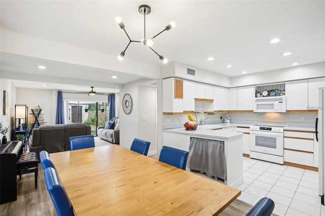 dining area with light tile patterned flooring, visible vents, a ceiling fan, and recessed lighting