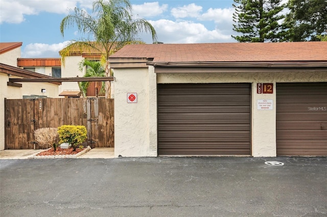 garage with fence