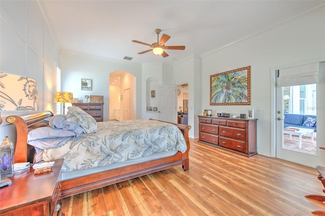 bedroom featuring light wood-type flooring, arched walkways, access to outside, and crown molding