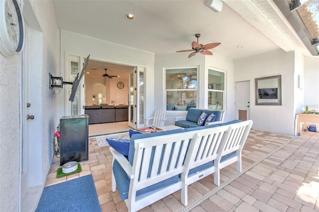 view of patio featuring ceiling fan and an outdoor living space