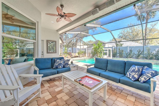 sunroom / solarium with a wealth of natural light and ceiling fan