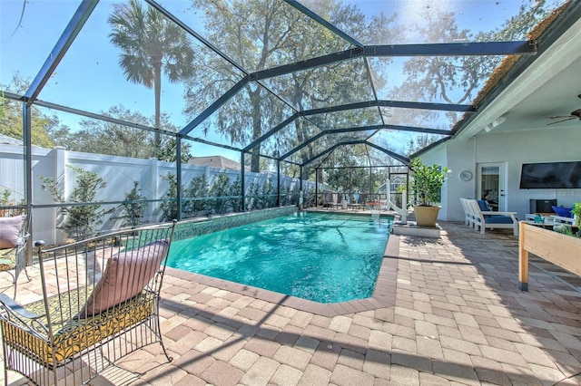 view of pool with ceiling fan, a patio area, a fenced backyard, and a fenced in pool