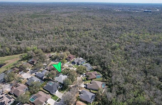 bird's eye view featuring a residential view and a view of trees