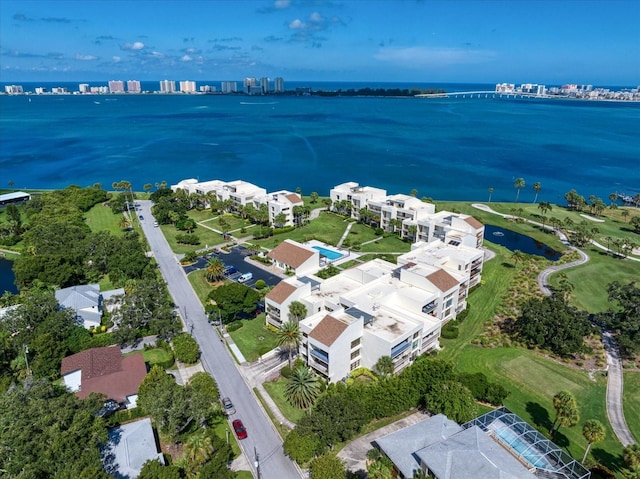 bird's eye view featuring a water view and a residential view