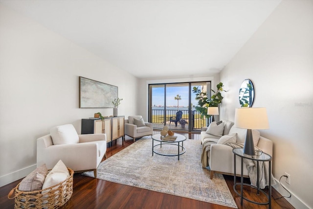 living room featuring baseboards and wood finished floors