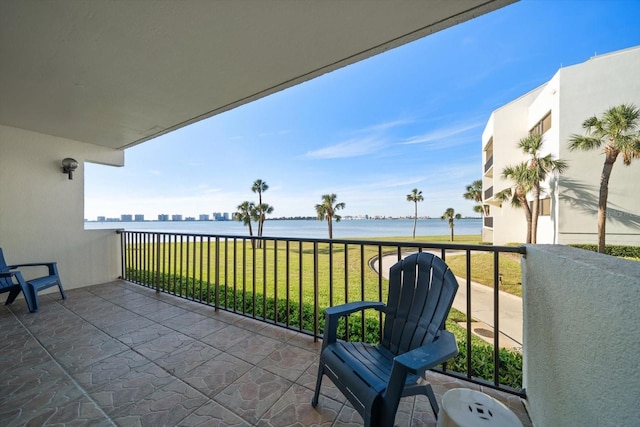 balcony featuring a water view