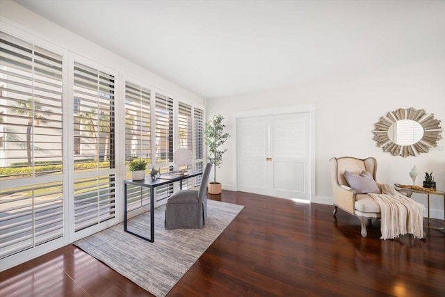 office featuring dark wood-type flooring and baseboards