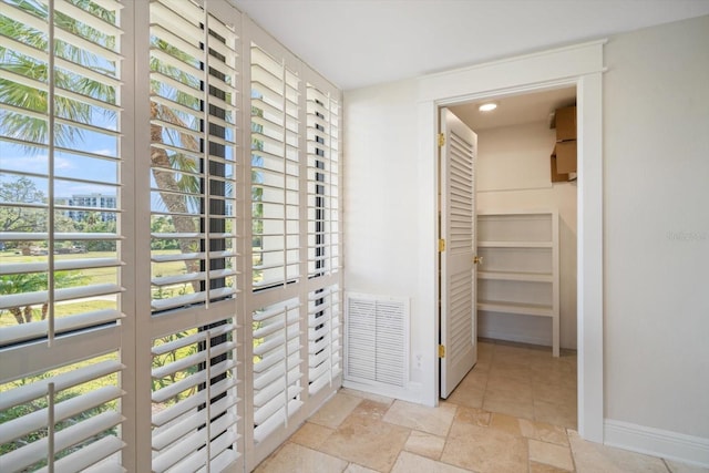 interior space with visible vents and stone tile floors