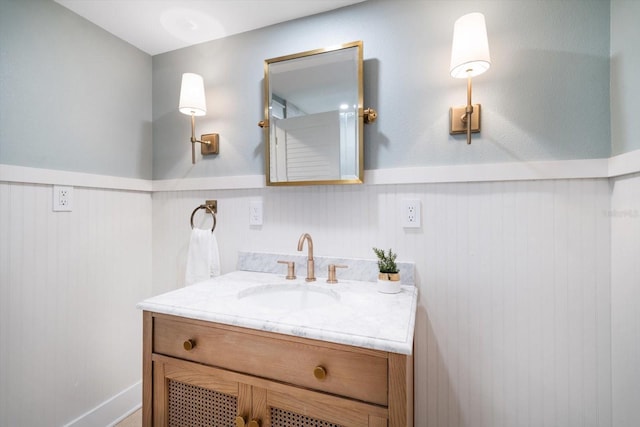 bathroom with wainscoting and vanity