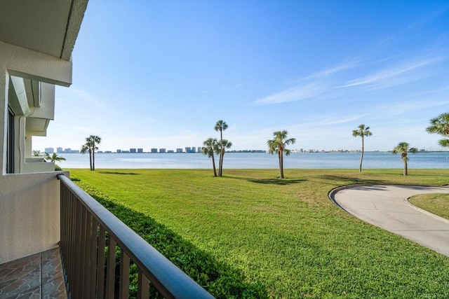 exterior space featuring a water view and a balcony