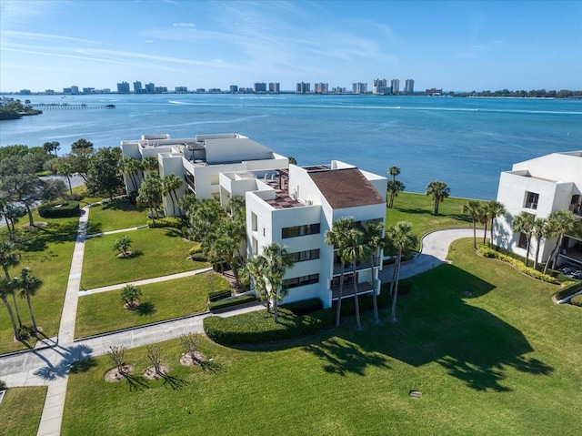 birds eye view of property with a city view and a water view