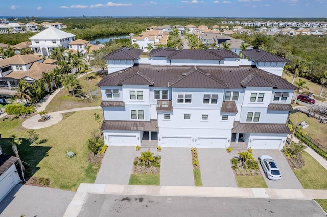 bird's eye view featuring a water view and a residential view