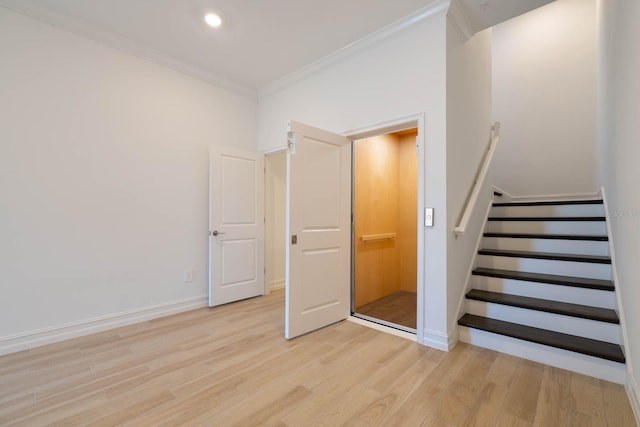 stairs featuring baseboards, ornamental molding, wood finished floors, and recessed lighting