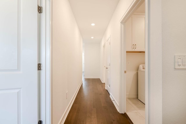 hall with dark wood-style floors, recessed lighting, washer / clothes dryer, and baseboards