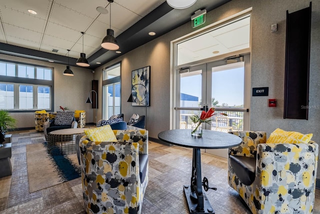 interior space featuring a healthy amount of sunlight and french doors