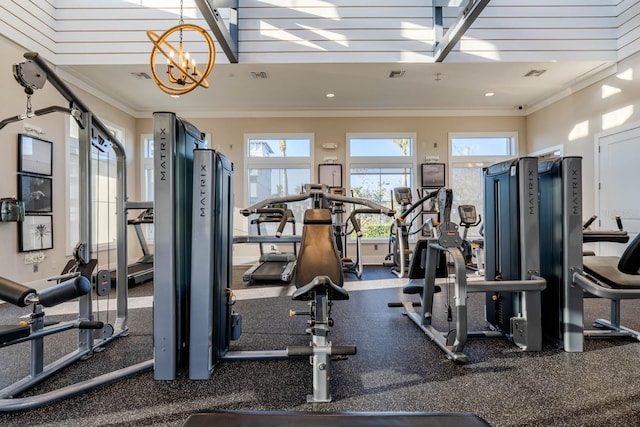 exercise room featuring a chandelier, visible vents, and crown molding