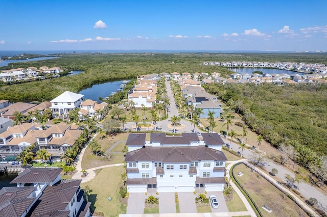 bird's eye view featuring a residential view and a water view