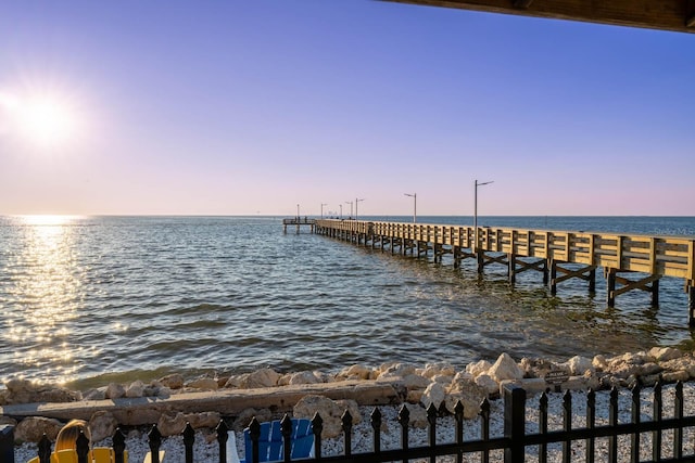 dock area with a pier and a water view