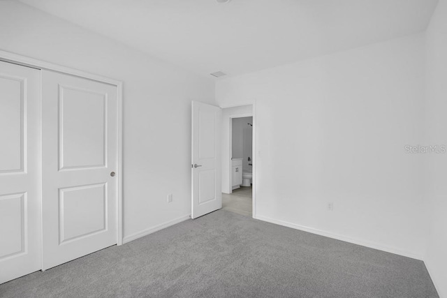 1931 Rosewood Cir, Lakeland, FL 33810 - unfurnished bedroom with carpet flooring and a closet