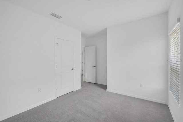 1931 Rosewood Cir, Lakeland, FL 33810 - unfurnished bedroom featuring carpet flooring