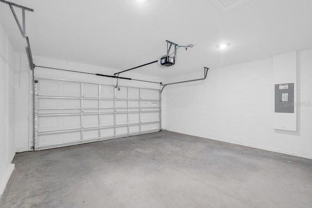 1931 Rosewood Cir, Lakeland, FL 33810 - garage with a garage door opener, electric panel, and concrete block wall
