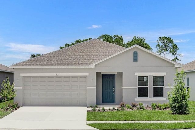 1931 Rosewood Cir, Lakeland, FL 33810 - view of front facade with a shingled roof, concrete driveway, a garage, and stucco siding