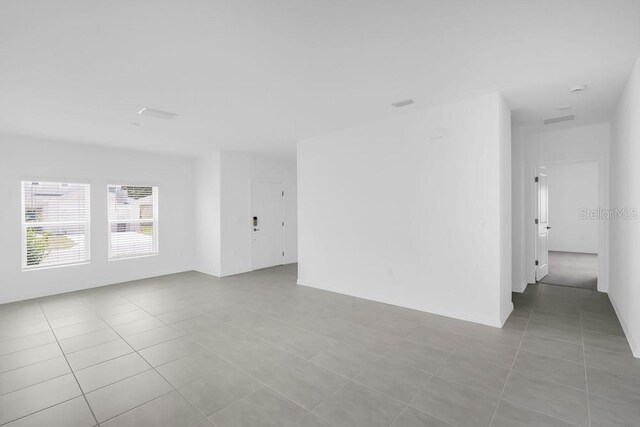 1931 Rosewood Cir, Lakeland, FL 33810 - unfurnished room featuring light tile patterned flooring