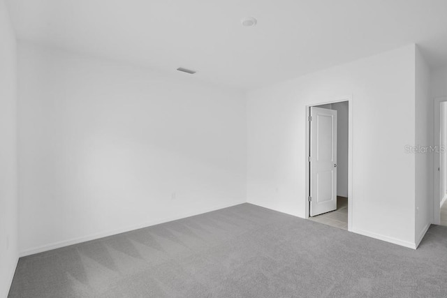 1931 Rosewood Cir, Lakeland, FL 33810 - carpeted empty room featuring baseboards