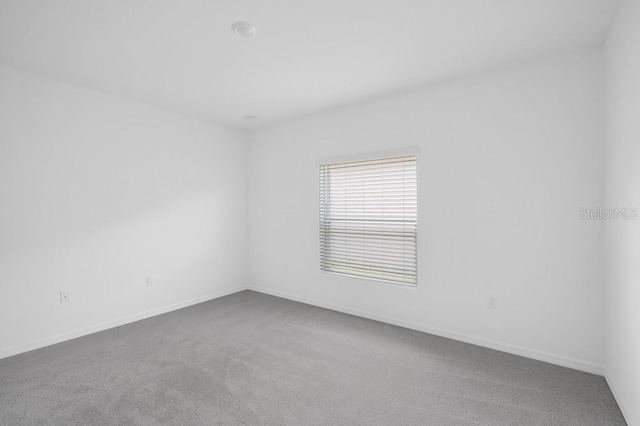 1931 Rosewood Cir, Lakeland, FL 33810 - carpeted empty room with baseboards