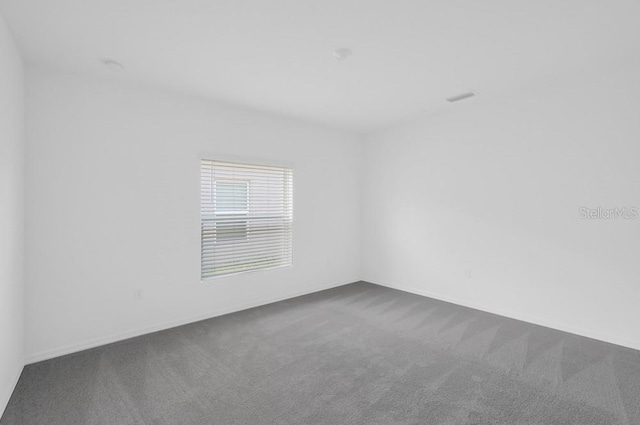 1931 Rosewood Cir, Lakeland, FL 33810 - spare room with dark carpet