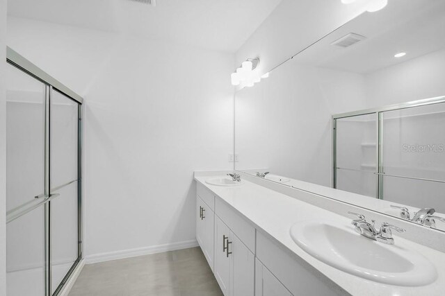 1931 Rosewood Cir, Lakeland, FL 33810 - bathroom with double vanity and a stall shower