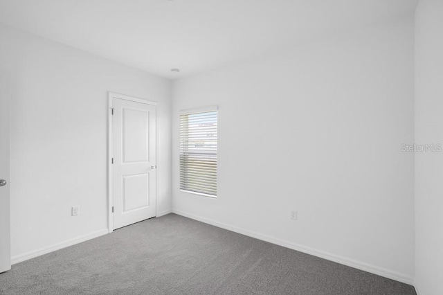 1931 Rosewood Cir, Lakeland, FL 33810 - carpeted empty room featuring baseboards