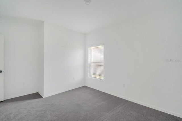 1931 Rosewood Cir, Lakeland, FL 33810 - unfurnished room with dark carpet