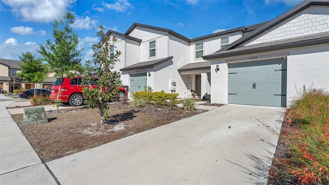 view of front of property with concrete driveway and stucco siding