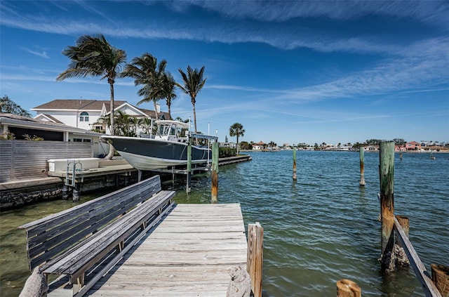 view of dock featuring a water view and boat lift