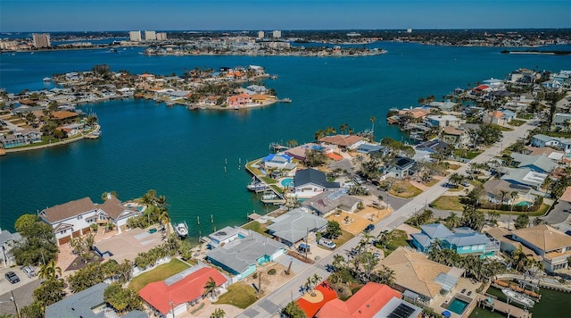 drone / aerial view with a residential view and a water view