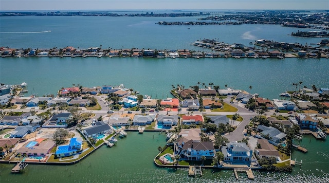 drone / aerial view with a water view and a residential view