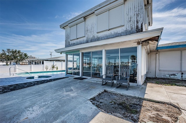 exterior space with a patio area, fence, and a fenced in pool