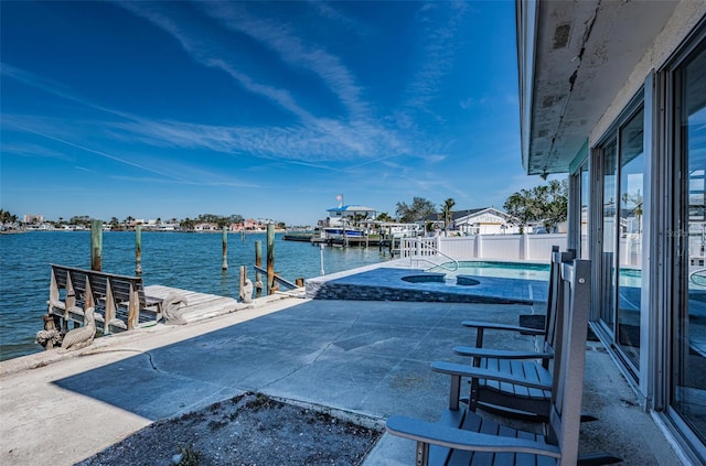 629 59th Ave, St Pete Beach, FL 33706 - view of dock with a patio, a water view, and an outdoor pool