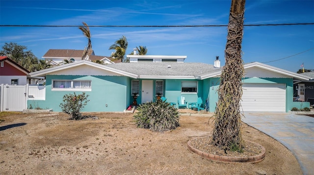 629 59th Ave, St Pete Beach, FL 33706 - ranch-style home featuring fence, an attached garage, driveway, and stucco siding