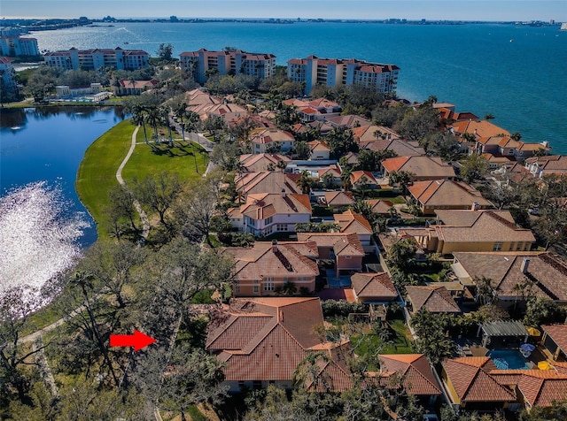 bird's eye view with a water view and a residential view