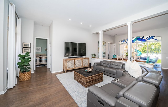 living area with baseboards, dark wood finished floors, decorative columns, and recessed lighting