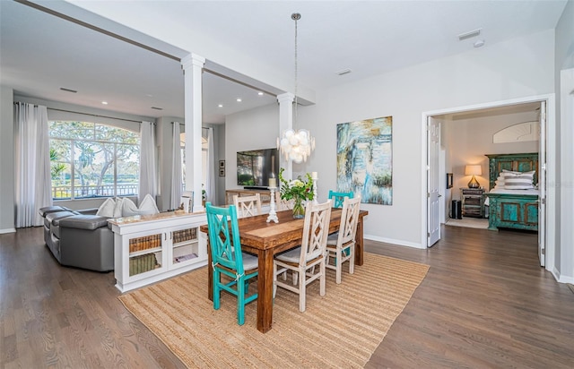 dining area featuring recessed lighting, decorative columns, baseboards, and wood finished floors