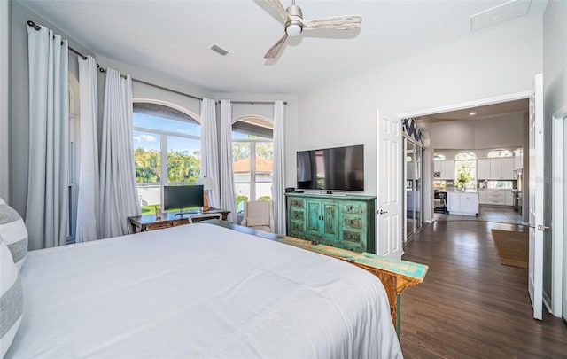 bedroom featuring ceiling fan, dark wood-type flooring, and visible vents