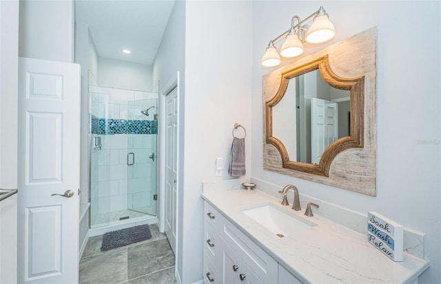 full bath with a shower stall and vanity