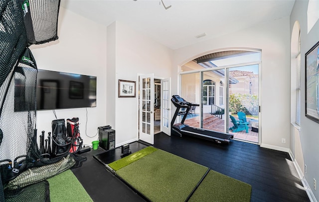 workout room featuring french doors and baseboards