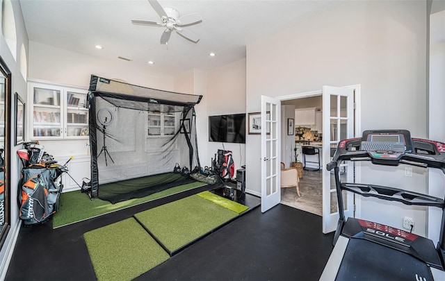 workout area featuring golf simulator, recessed lighting, french doors, and visible vents