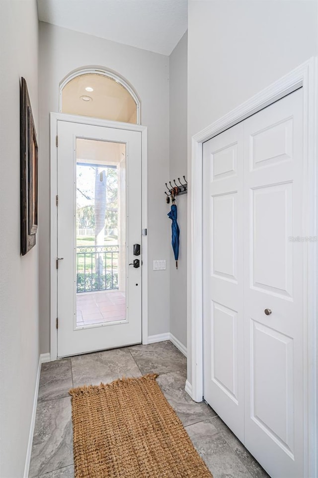 entryway featuring baseboards