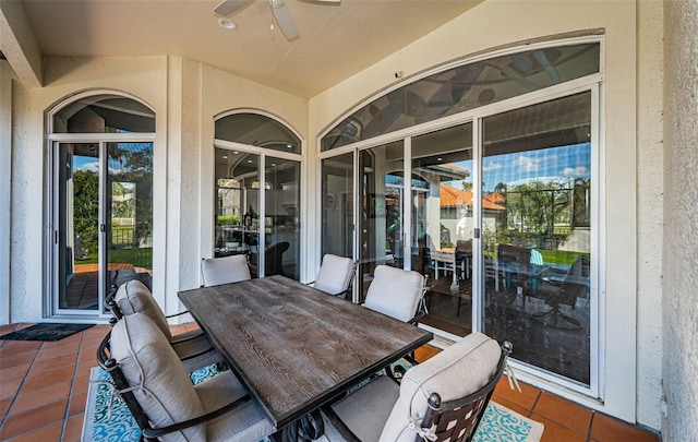 view of patio / terrace featuring outdoor dining area and a ceiling fan