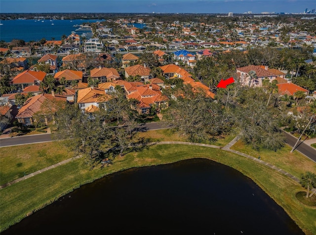 bird's eye view featuring a residential view and a water view